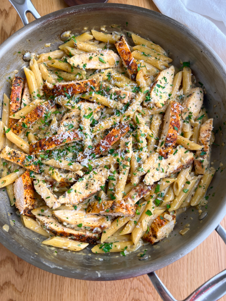 Slice the cooked chicken into strips and add it back to the pan. Toss everything together until well combined. Serve warm and enjoy