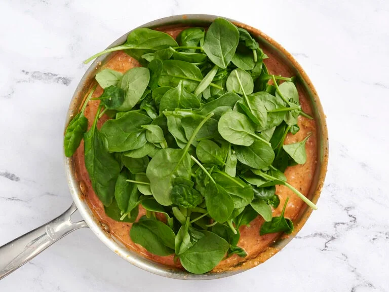 Add the spinach and gently fold it into the sauce until wilted, about 2–3 minutes.