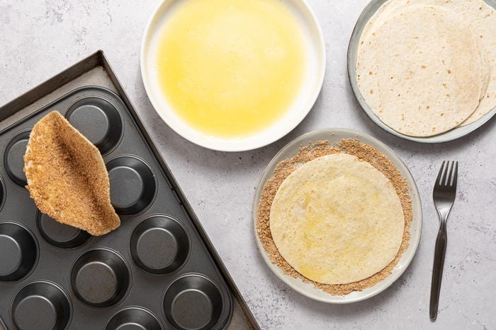 Dip both sides of each tortilla into the melted butter