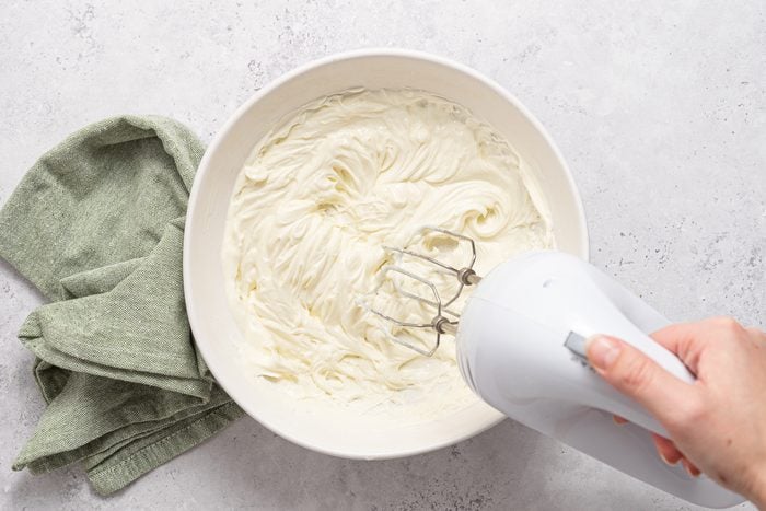 For the filling, beat the softened cream cheese in a large bowl on medium speed for 3 to 4 minutes until smooth