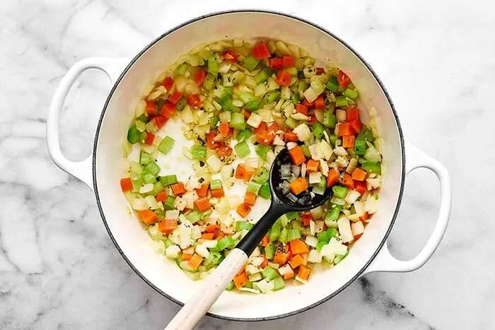 Add the minced garlic, dried oregano, dried basil, and salt. Stir well and cook for another minute until fragrant.