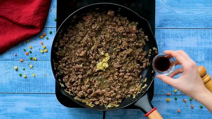 Stir in the Worcestershire sauce and minced garlic. Cook for 1 minute, just until fragrant.