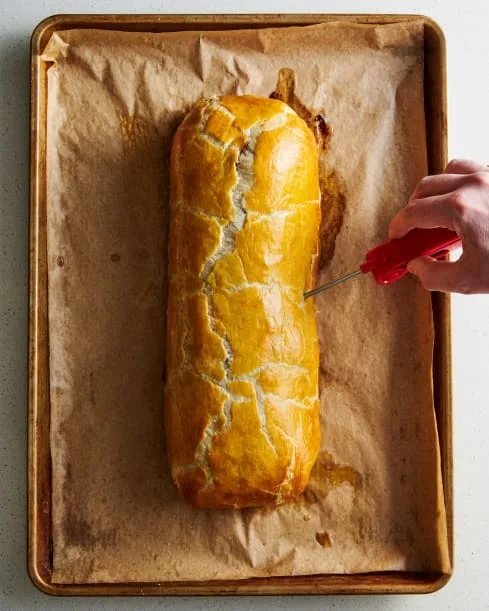 Bake for 40 to 50 minutes, until the center reaches 105ºF for medium-rare and the pastry is golden brown. If the top browns too quickly, loosely cover with foil.