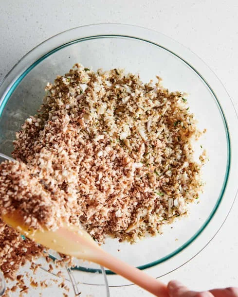 Add the remaining mushrooms to the food processor and pulse until finely chopped. Add them to the bowl as well. If you prefer, you can finely chop everything by hand.