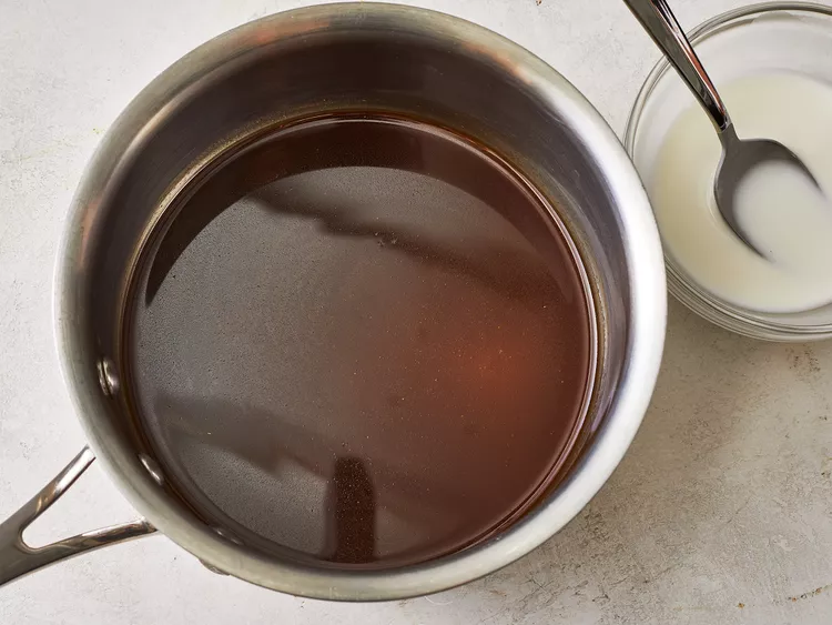 In a small cup, mix the cornstarch with ¼ cup of cold water. Stir until the cornstarch fully dissolves and the mixture is smooth.