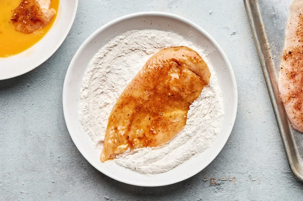Place a cooling rack over a rimmed baking sheet. Sprinkle the chicken with the remaining spice mixture.