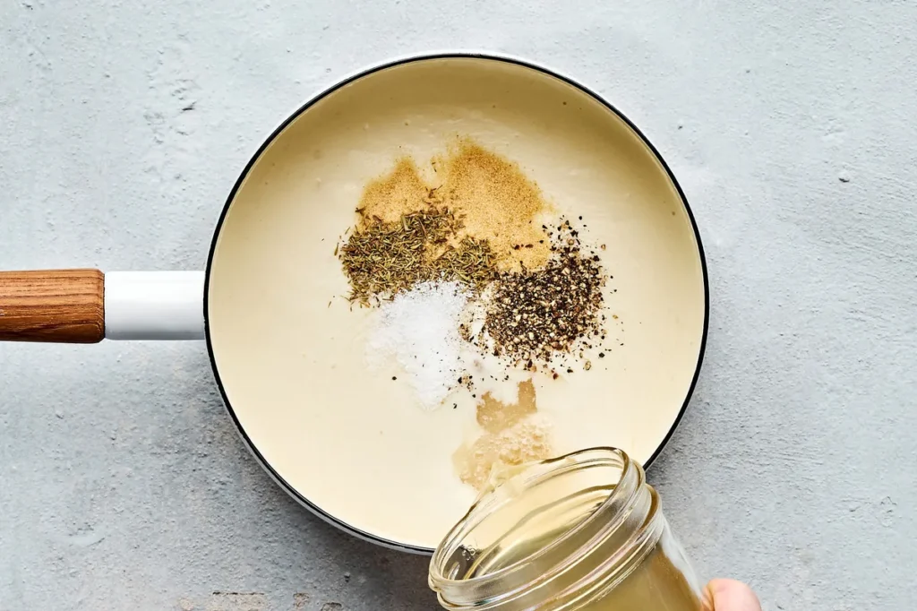 To make the gravy, melt the butter in a small saucepan over medium low heat. In a bowl, whisk the flour with ½ cup of the chicken stock until smooth.