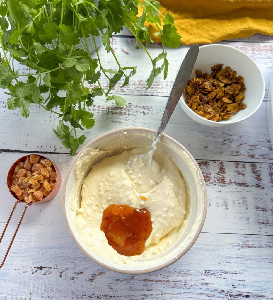 Add the mayonnaise a little at a time, whisking well after each addition until the mixture is smooth and creamy.