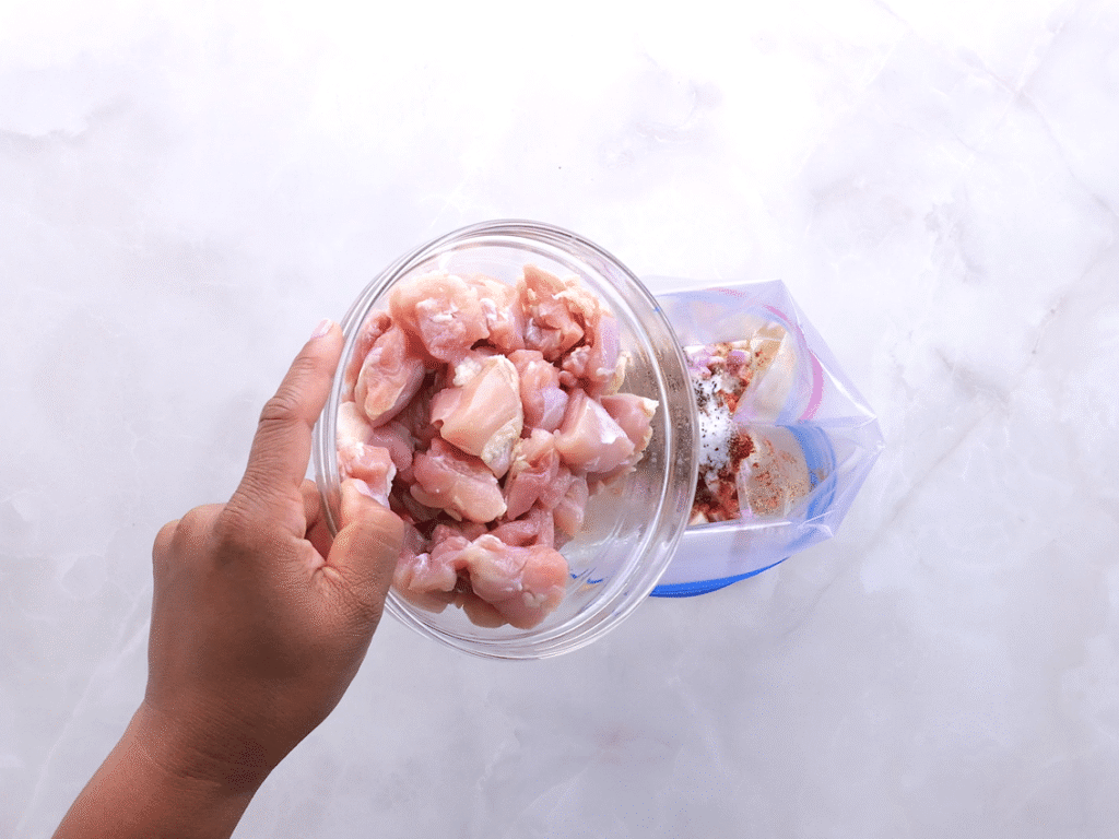 Marinate the chicken. In a large bowl or zip top bag, combine the Greek yogurt, olive oil, garlic, shallot, lemon juice, paprika, oregano, red pepper flakes, salt, and pepper. Add the cubed chicken and mix well so everything is coated. Let it marinate for 15 minutes at room temperature or overnight in the refrigerator.