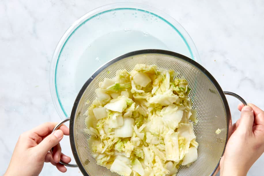 Rinse the cabbage under cold water three times to remove excess salt. Let it drain in a colander for 15 to 20 minutes.