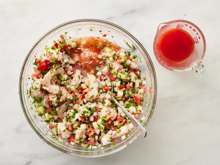 Pour in the tomato and clam juice cocktail a little at a time until you reach your preferred consistency.