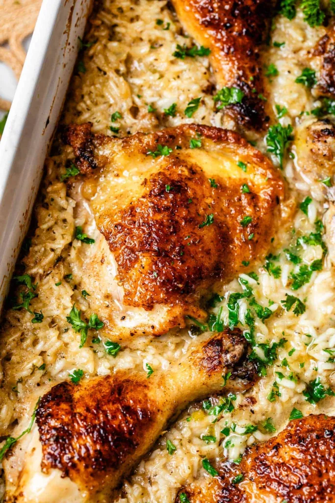 Let the casserole rest before serving so the sauce thickens and the rice finishes absorbing the liquid, then garnish with parsley.