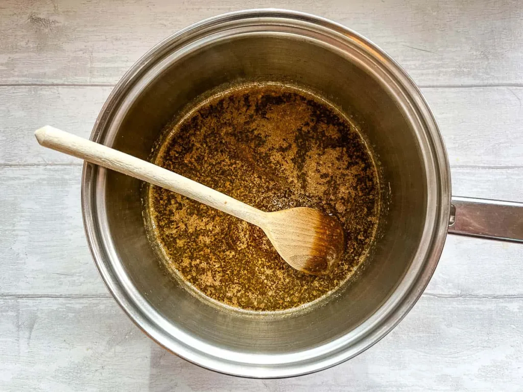 Add the brown sugar and golden syrup to the melted butter, stirring until everything is fully combined and smooth, then remove from heat.