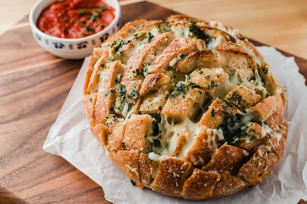 Remove from the oven and serve immediately with marinara sauce on the side for dipping.