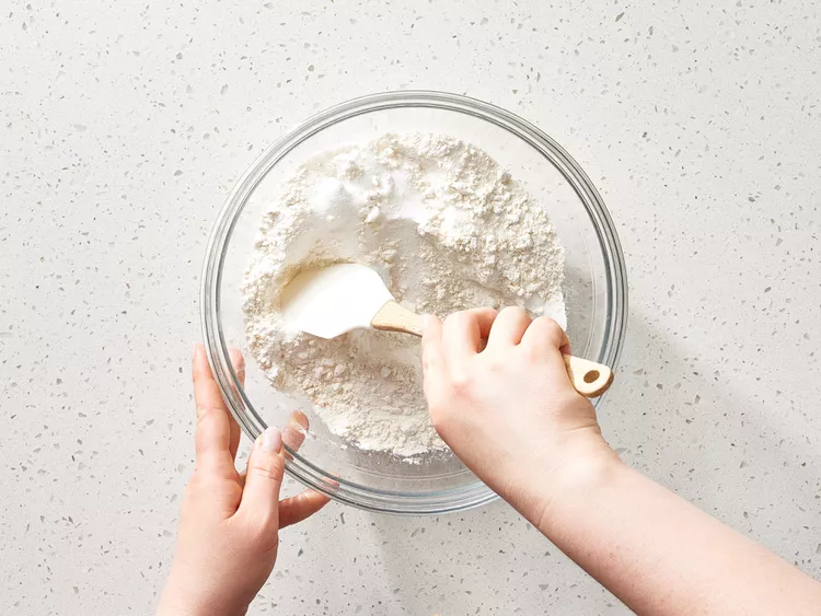 In a large bowl, stir together the flour, sugar, baking soda, and salt until everything is evenly combined.