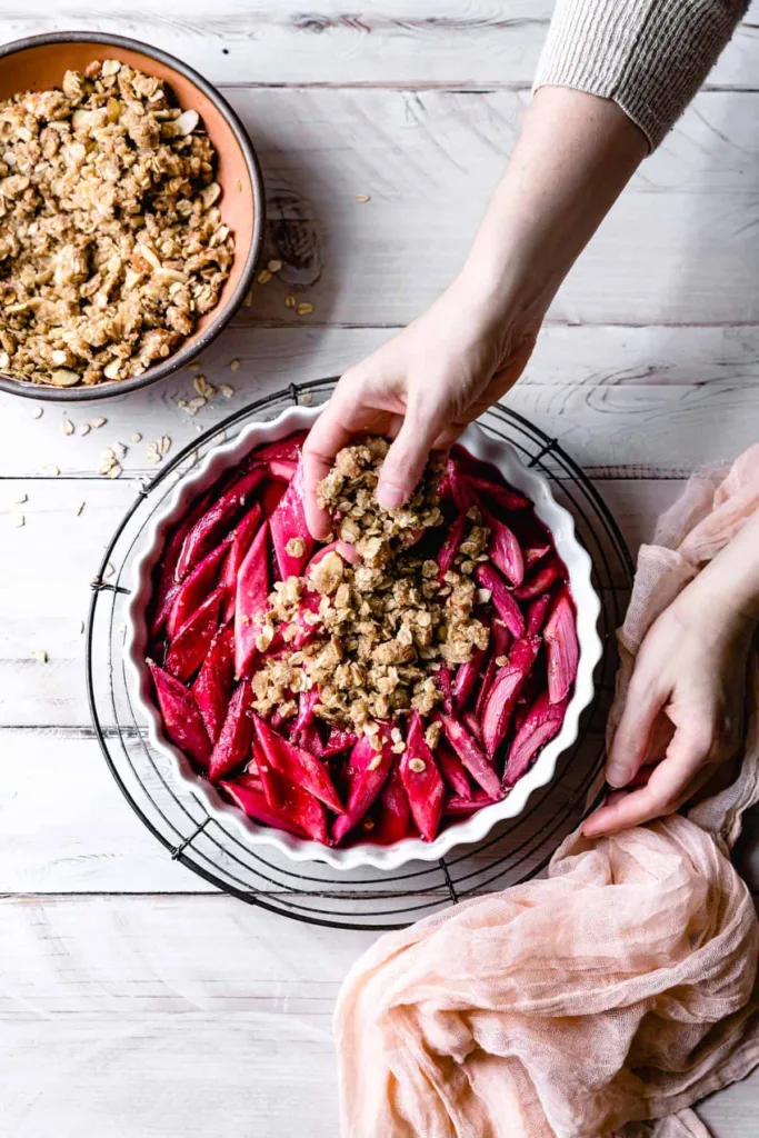 Return the dish to the oven and bake until the topping becomes deeply golden and the filling bubbles around the edges.