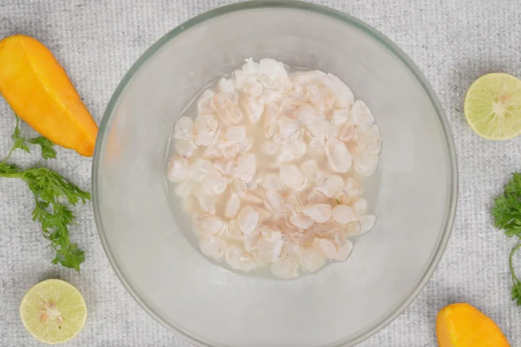 Place the shrimp in a bowl and pour the lime juice over them, making sure all pieces are well coated.
