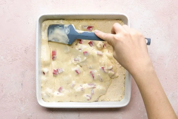Fold the diced rhubarb gently into the filling so it stays evenly distributed throughout the mixture.