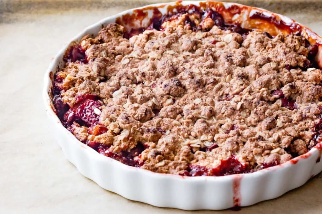 Bake until the topping becomes deeply golden and the fruit filling bubbles thickly around the edges.
