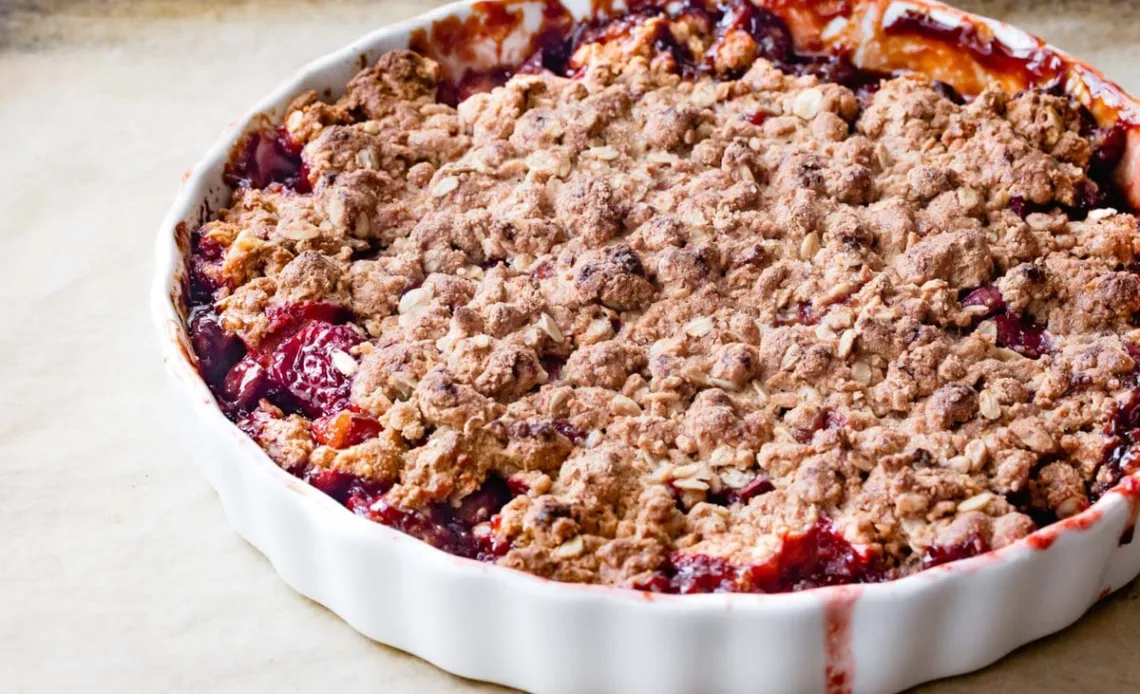 Bake until the topping becomes deeply golden and the fruit filling bubbles thickly around the edges.