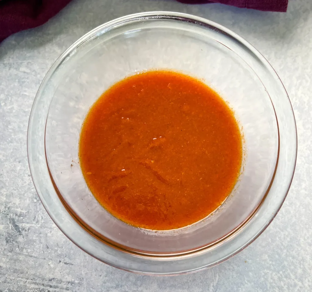 Blend the mixture using an immersion blender or high-powered blender until the sauce becomes thick, smooth, and fully combined.