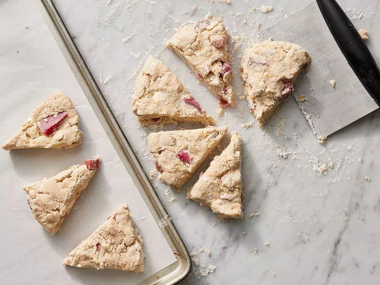 Brush the tops with heavy cream and sprinkle generously with turbinado sugar for a crisp finish.