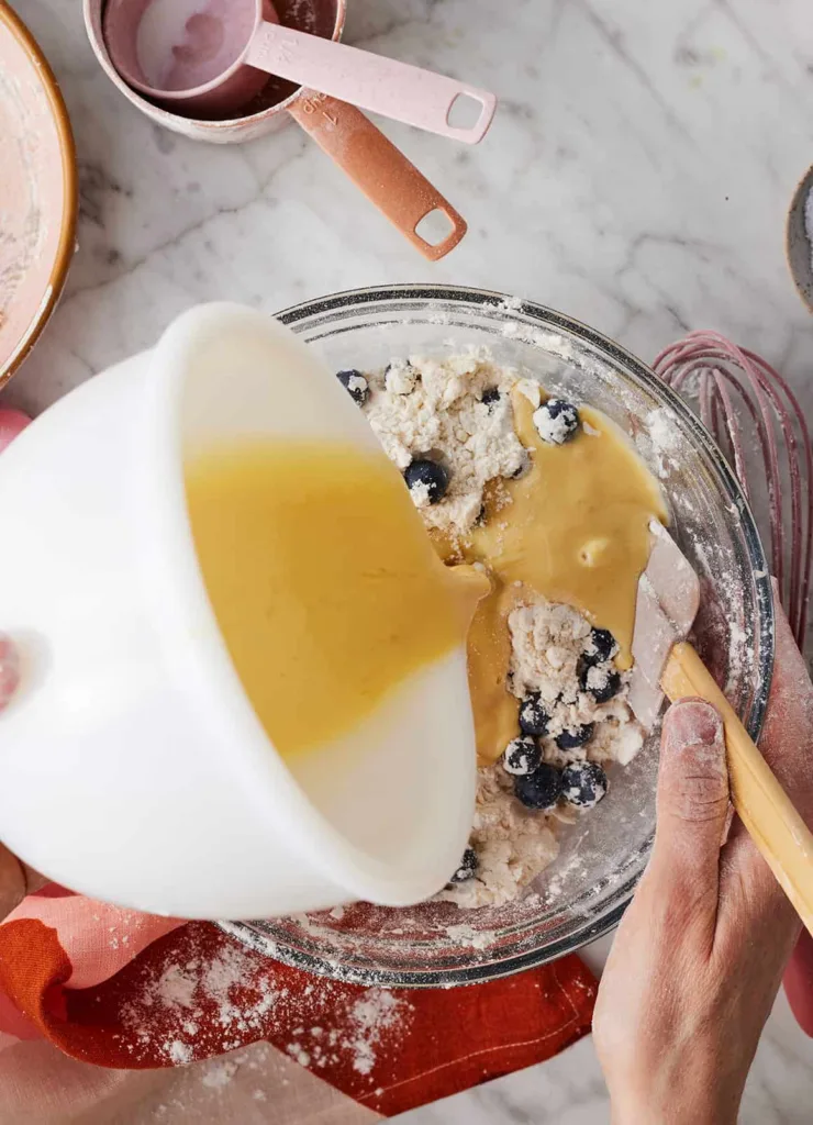 In a separate bowl, whisk together the buttermilk, egg, and vanilla, then pour it over the dry ingredients and mix until a soft dough forms.
