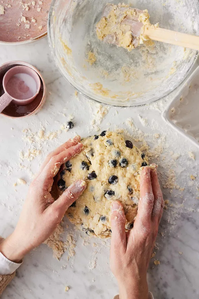 Knead the dough lightly with your hands just until it comes together, adjusting with a little flour or buttermilk if needed.